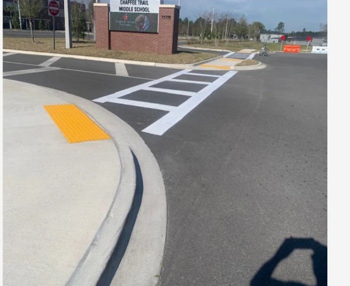 New crosswalk striping, ADA detectable warning pad, and curb work at the Chaffee Trail Middle School entrance