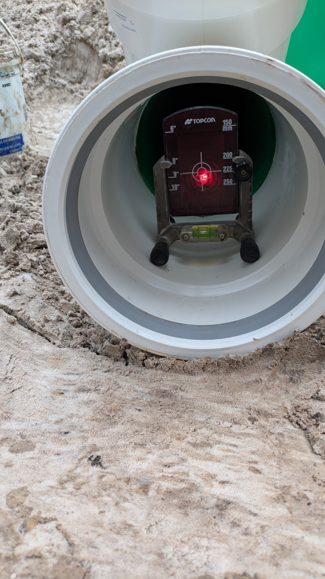 Topcon laser target centered inside a large-diameter sewer pipe
